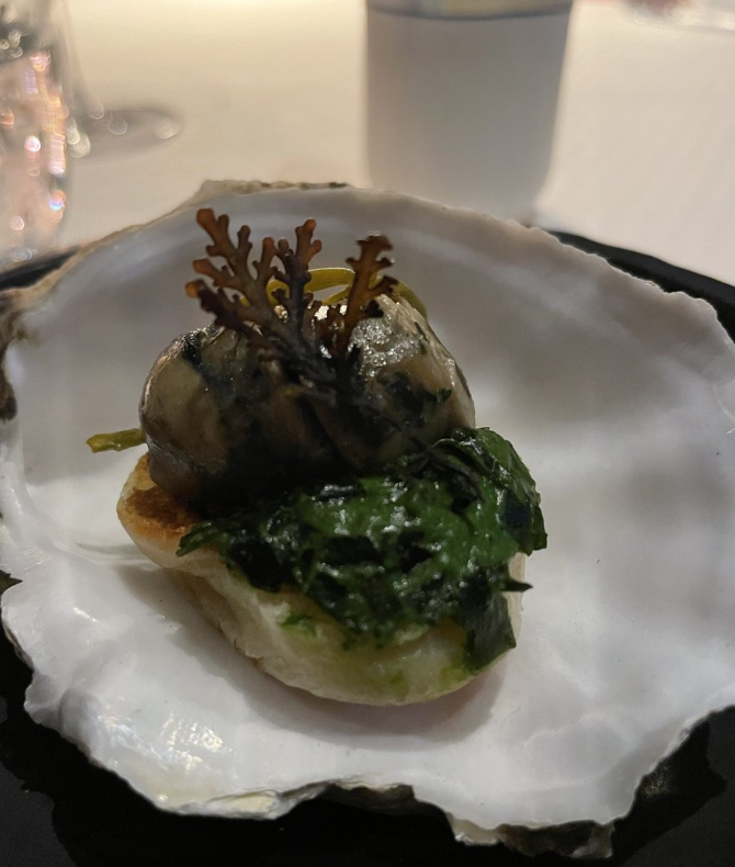 Served with a bit of seaweed in a beautiful real shell